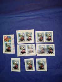 Почтовые марки Канады и США . Б/У - вырезанные с конвертов .
